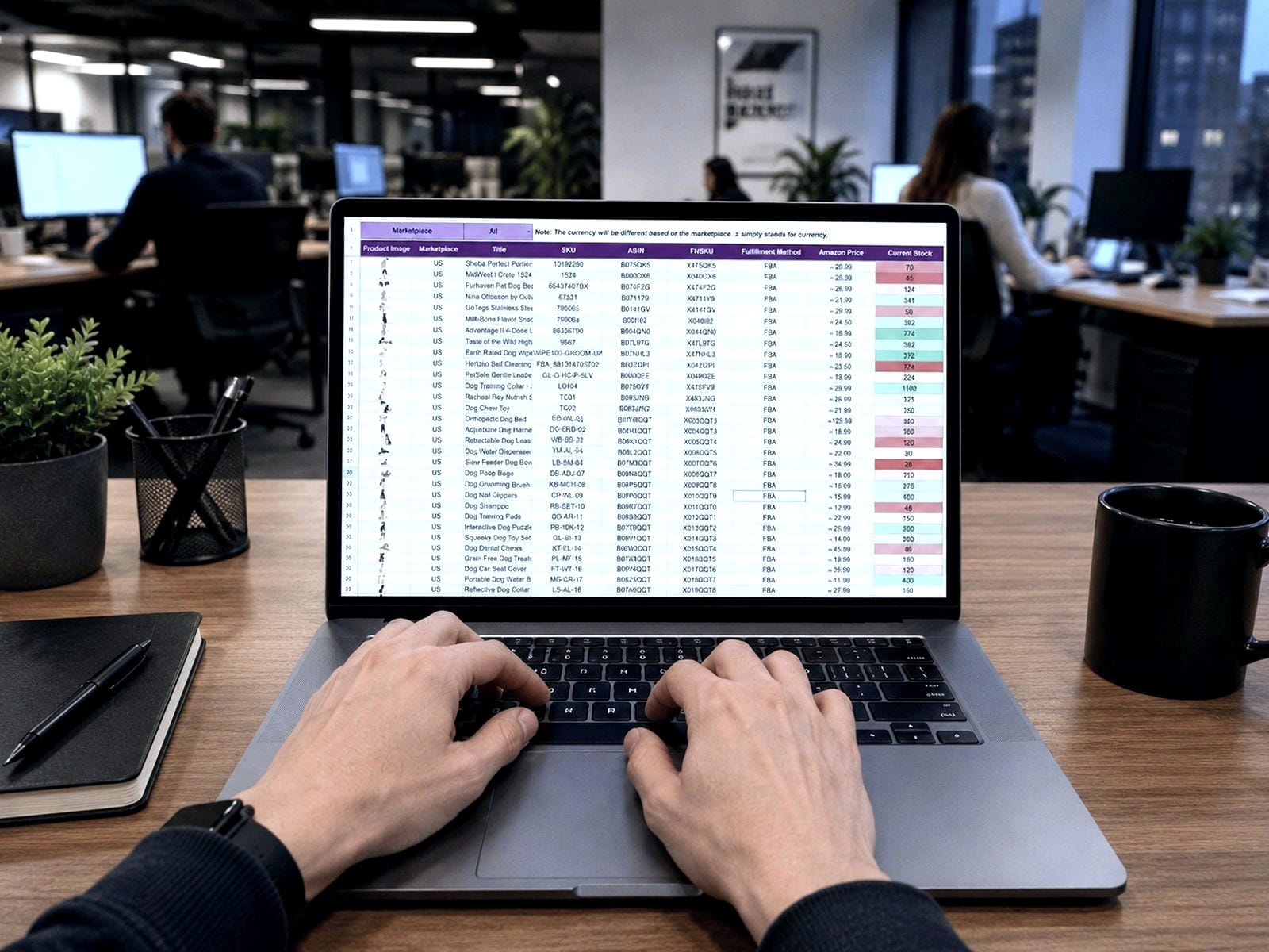 Hands typing on a laptop showing a spreadsheet, at an office desk.